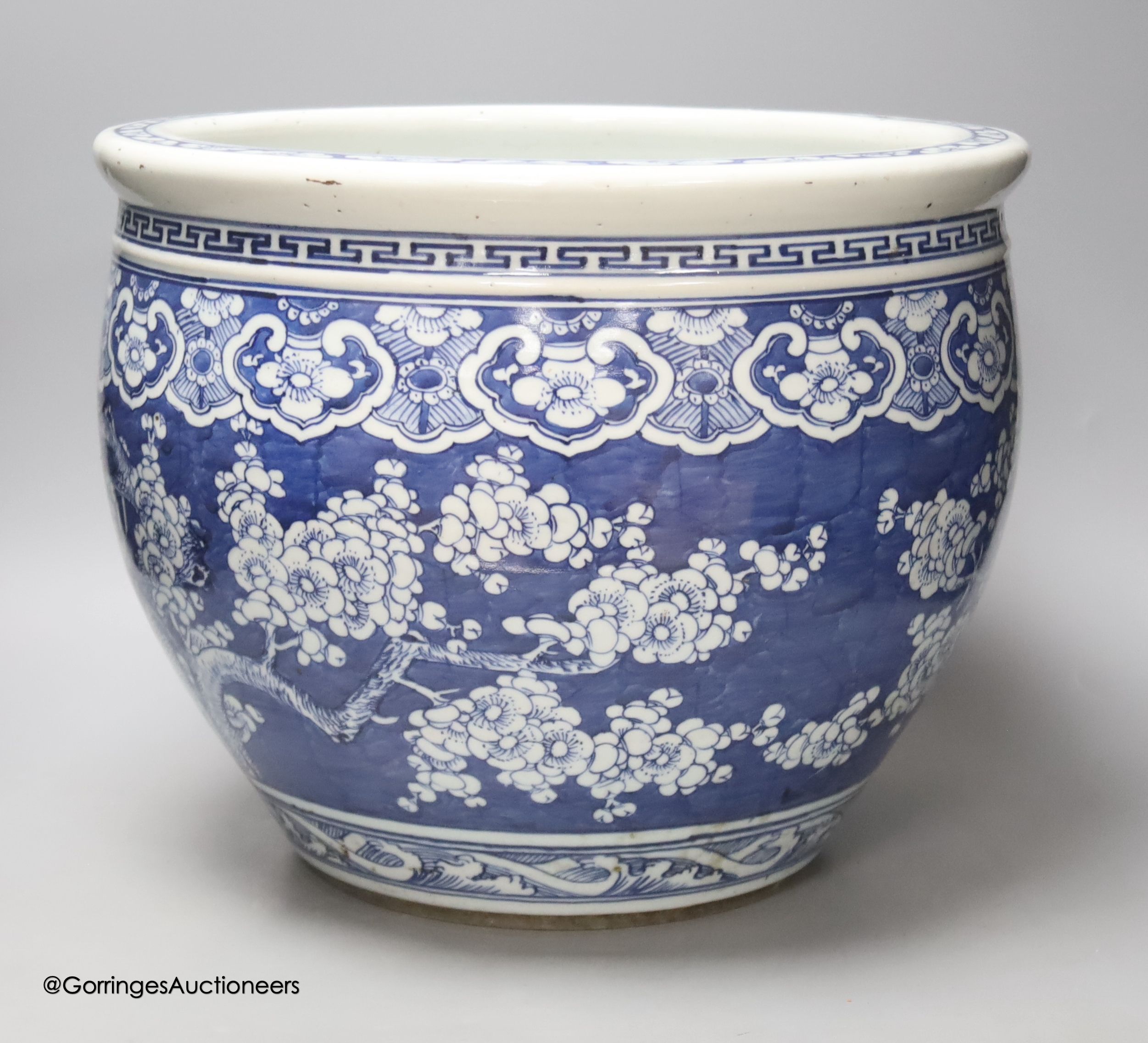 A Chinese blue and white prunus jardiniere, late 19th century, diameter 37.5cm